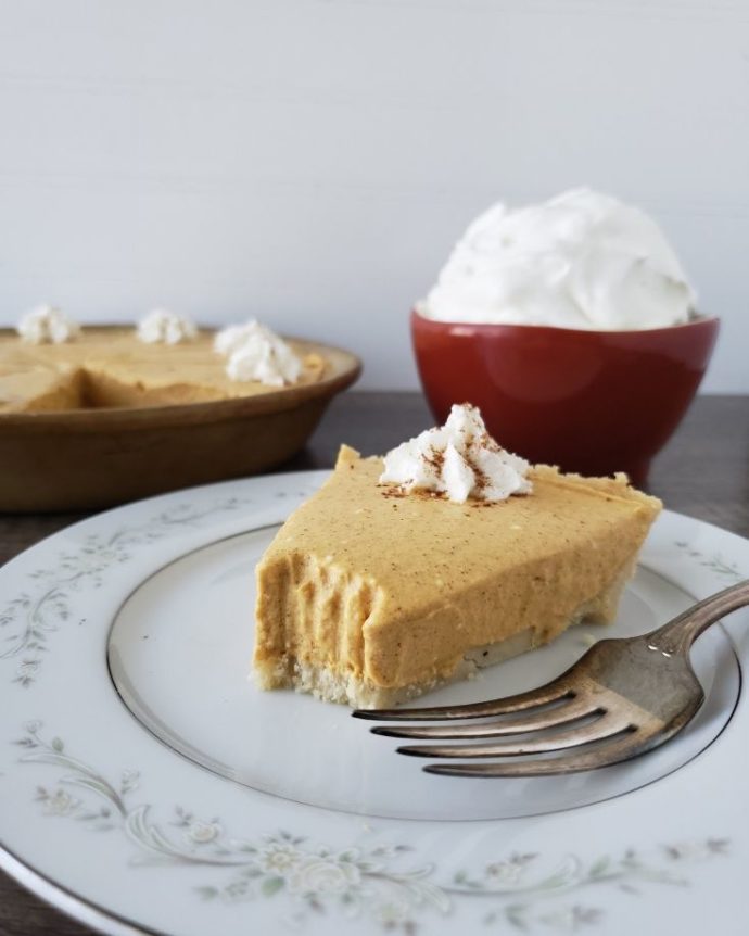 plated slice of pumpkin pie