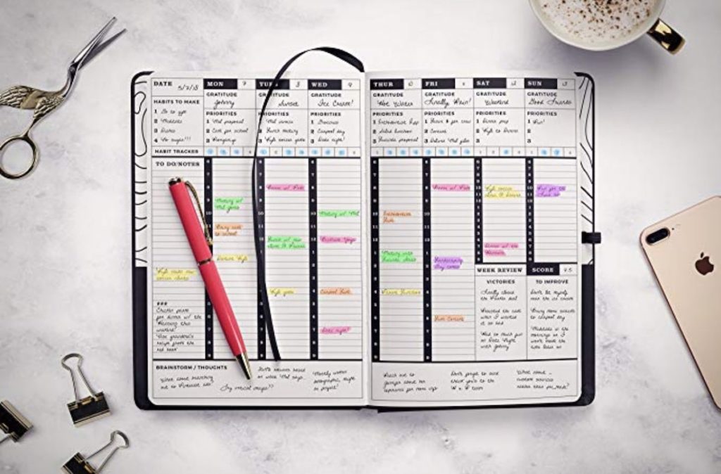 A planner open where you can see schedule