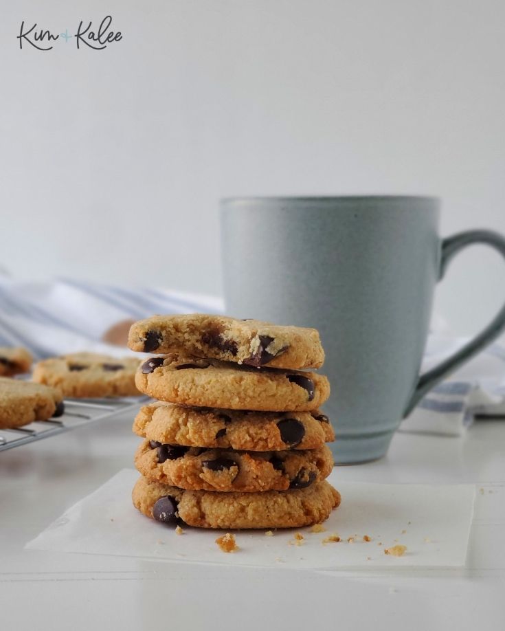 5 Low Carb Chocolate Chip Cookies with a Mug Behind Them