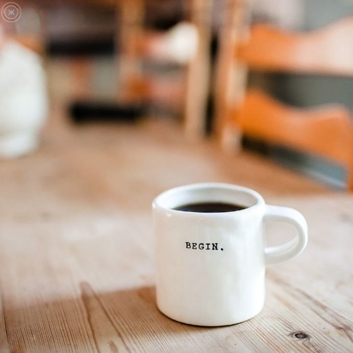 picture of a coffee mug that says begin