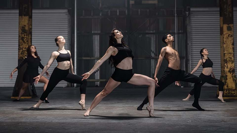 A group of 5 doing LES MILLS On Demand Barre