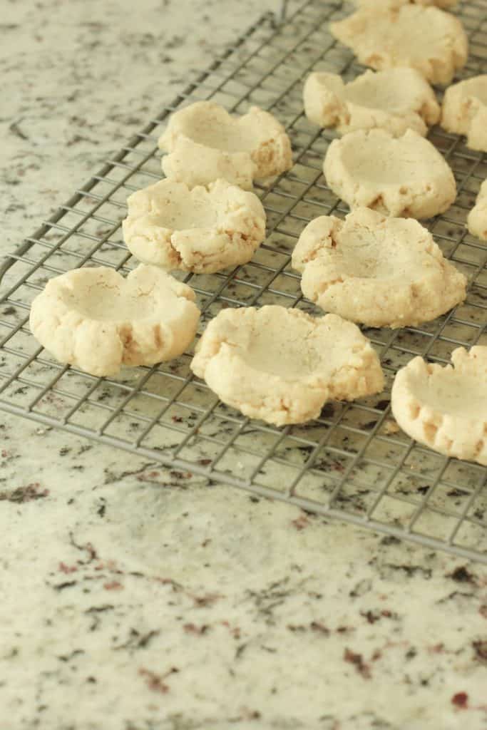 making thumbprint cookies with pecans