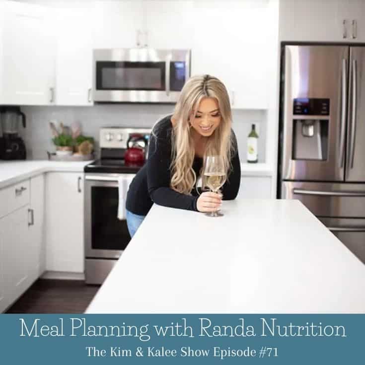 Randa in her kitchen with glass of wine