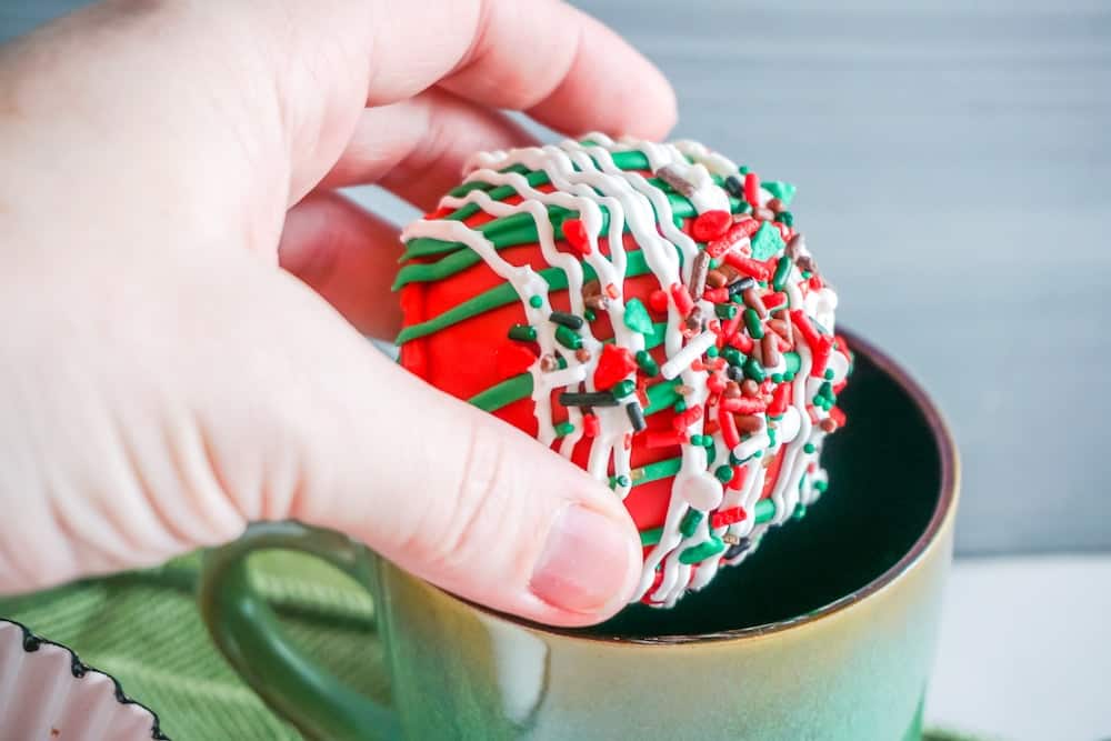 Christmas Hot Chocolate Bombs about to go into a mug