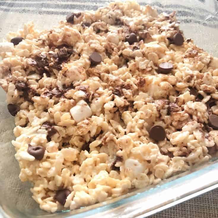 the dish of rice krispie treats with chocolate chips and marshmallows