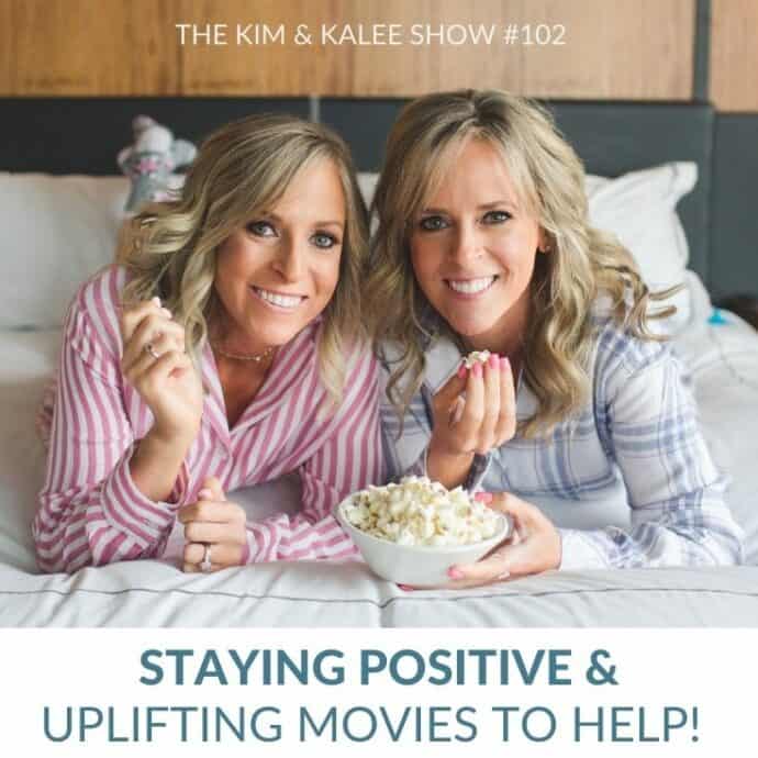 Kalee & Kim laying on bed eating popcorn