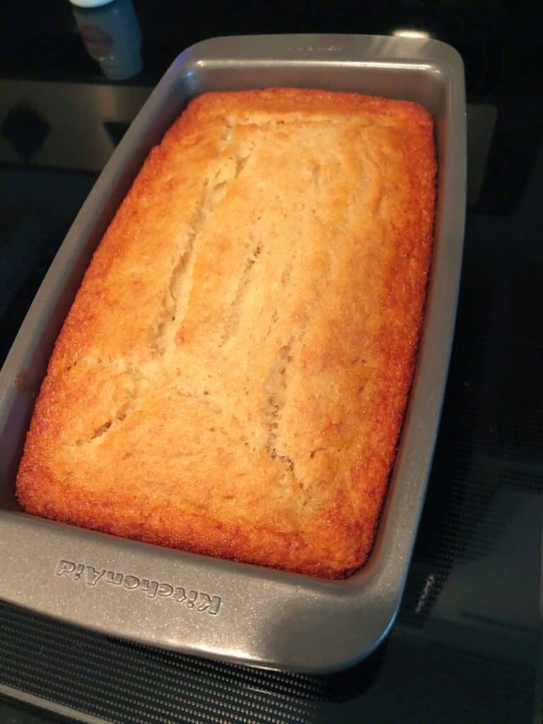 banana bread out of the oven in loaf pan