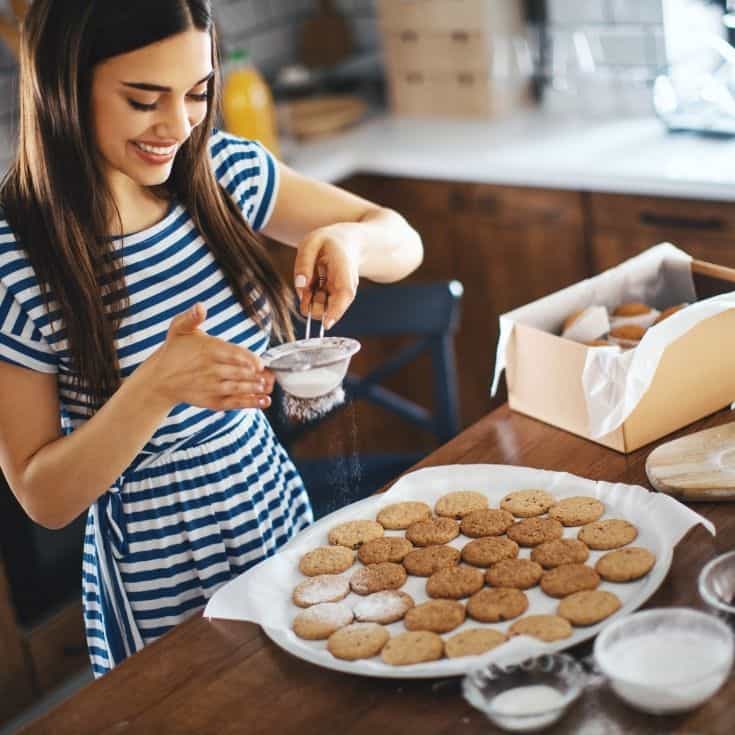 woman making cookies for a care package for boyfriend