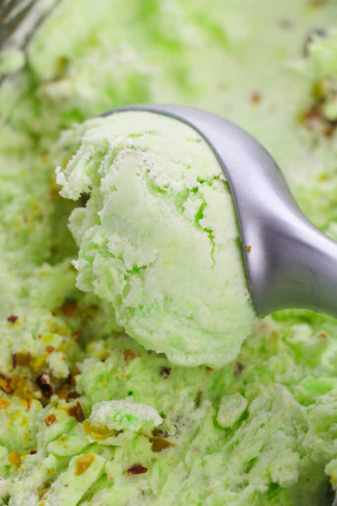 scooping the pistachio ice cream