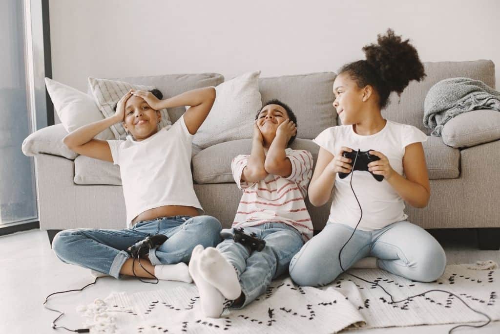 3 kids playing video games