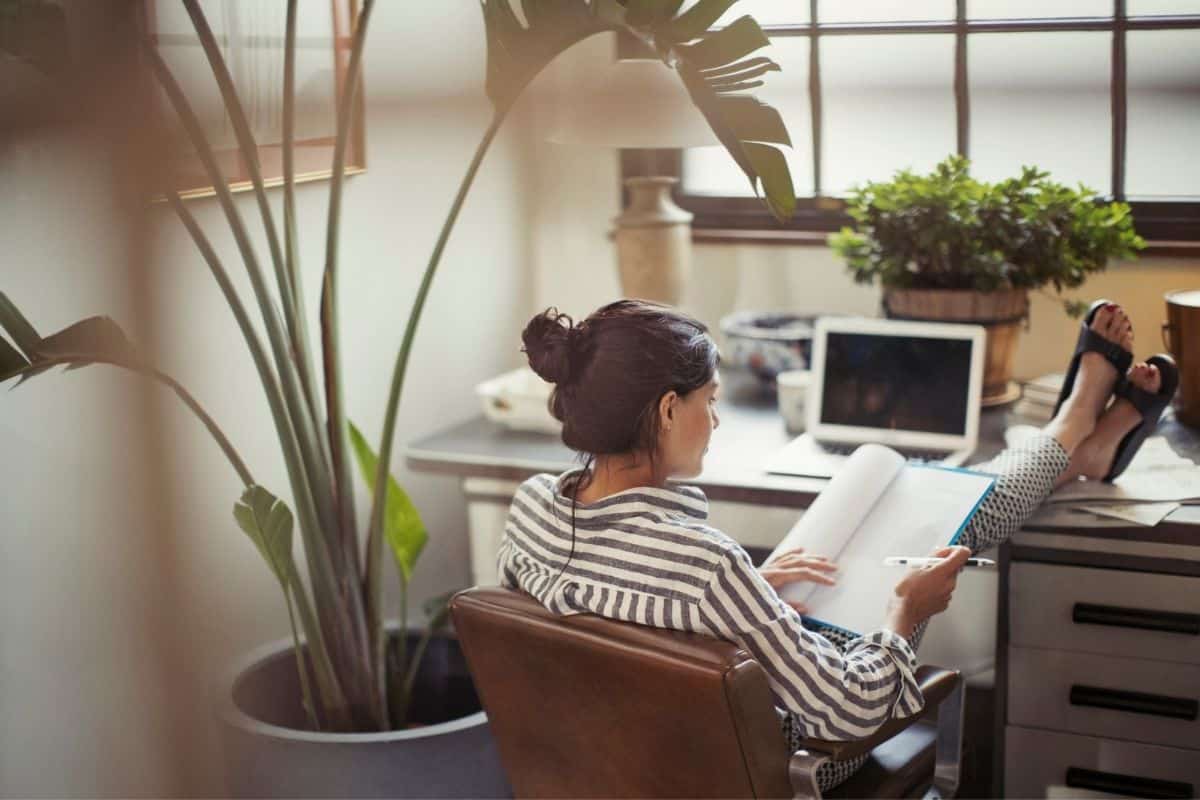 woman working from home with feet up on the desk