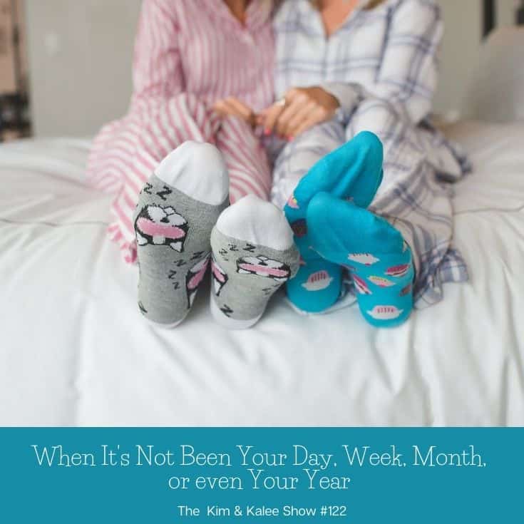 Kalee & Kim on bed with sock feet towards camera