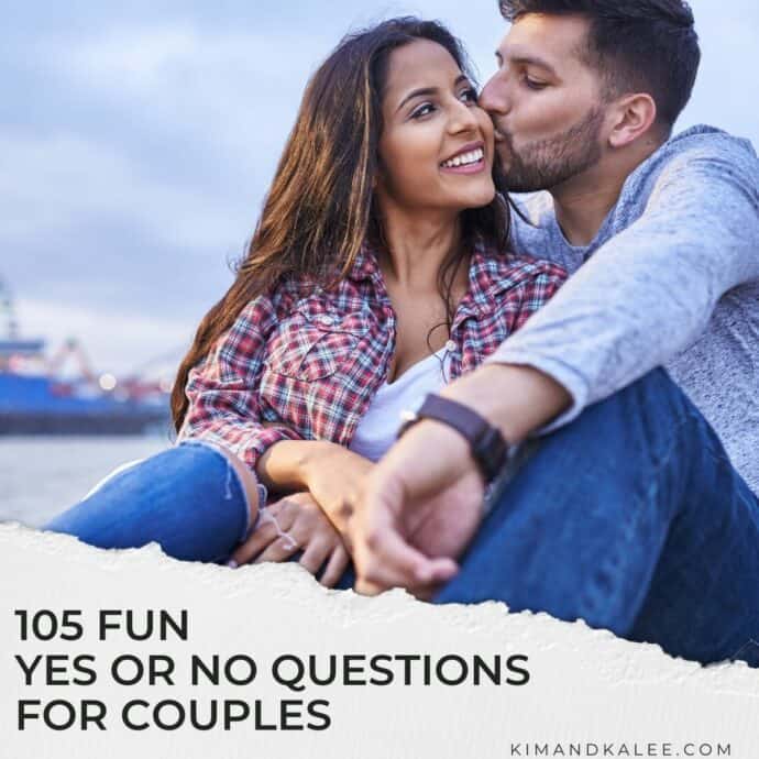 man kissing a woman's cheek outside at the beach with text overlay "105 fun yes or no questions for couples"