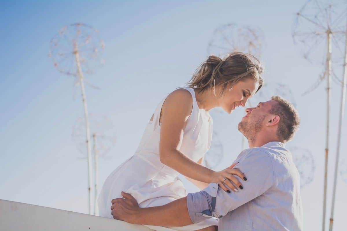 couple outside with their faces close together