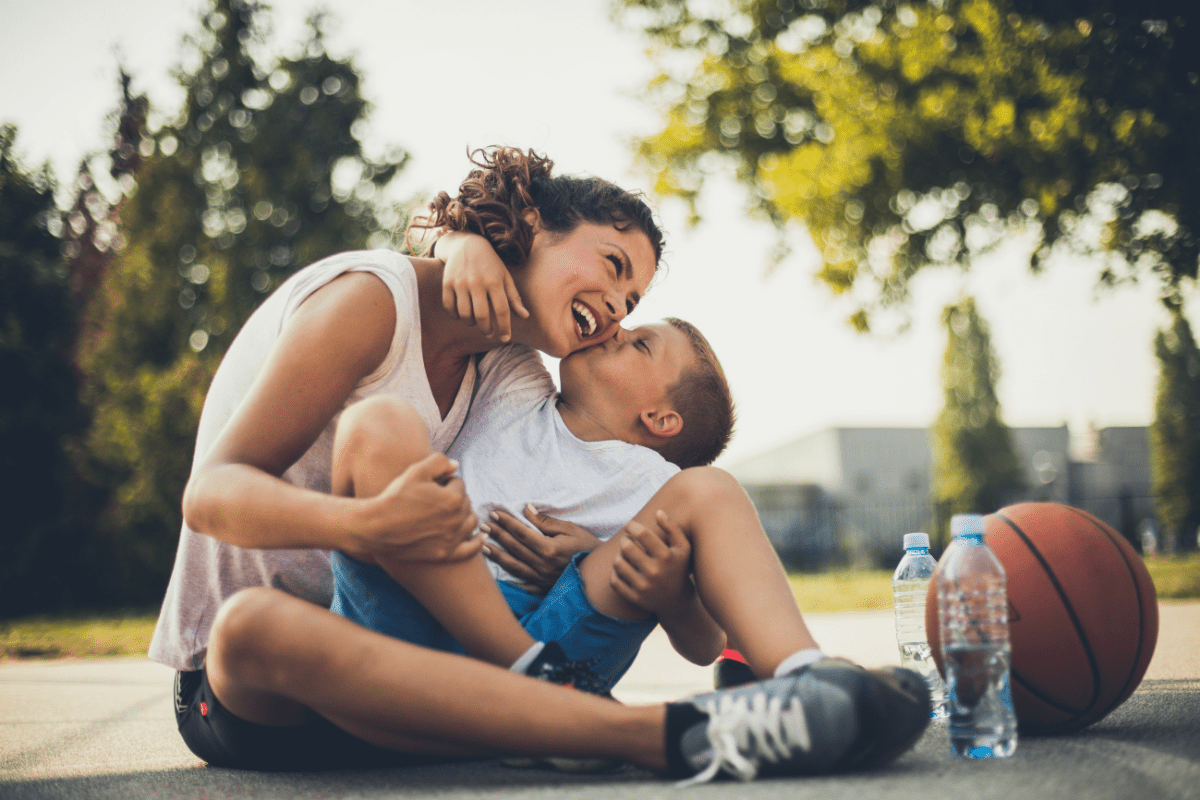 little boy kissing his mom