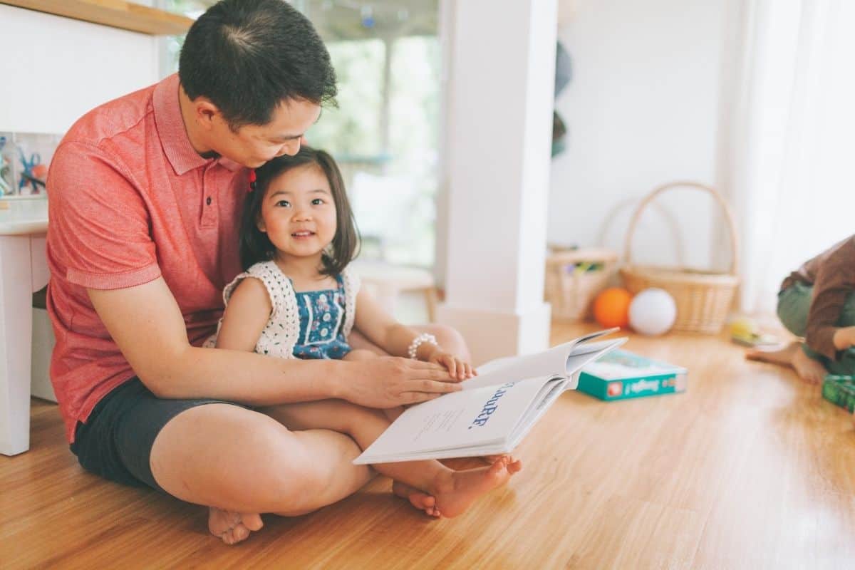 dad reading to his daughter