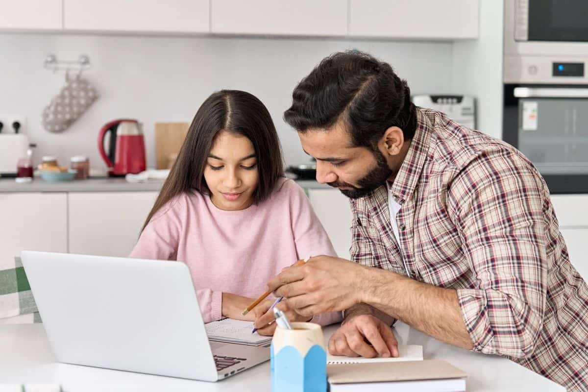 daughter and daddy taking an online class