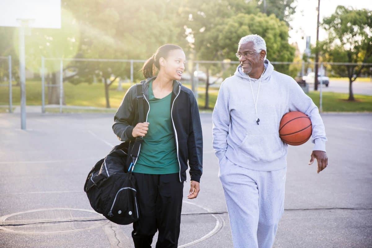 father and daughter after playing basketball