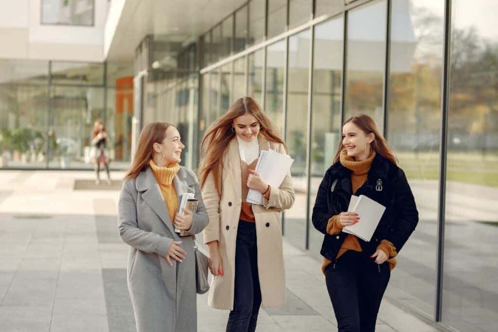 3 college girls walking in the winter