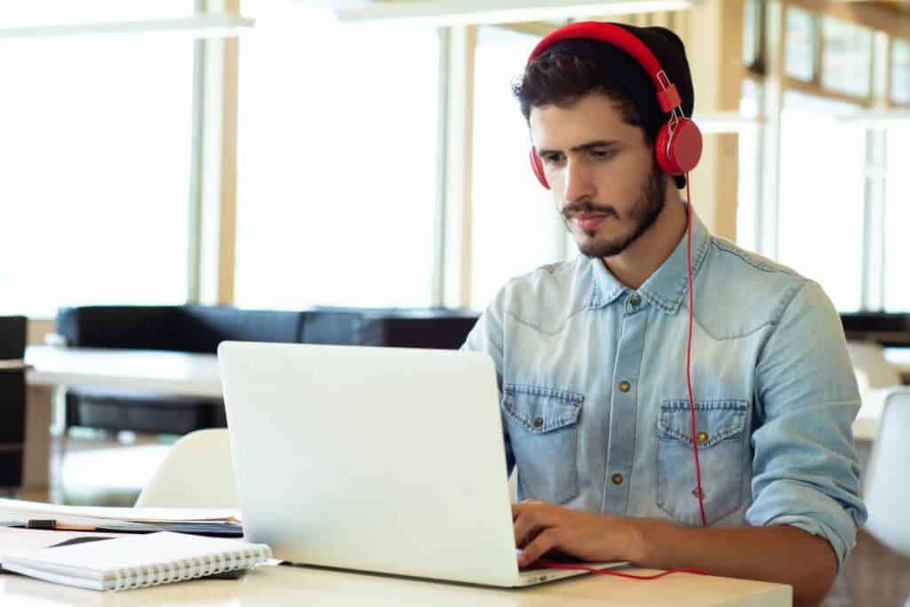 male college student on his laptop