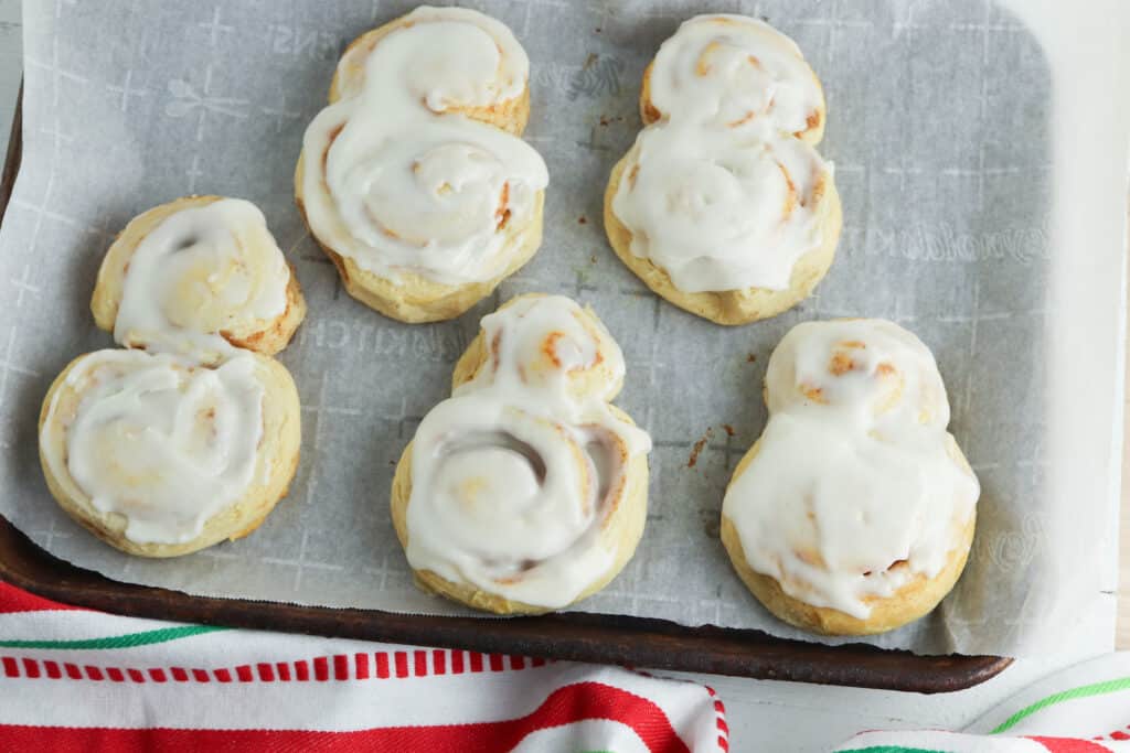 frosted snowman cinnamon buns undecorated