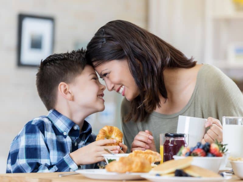 mom and son enjoying breakfast together