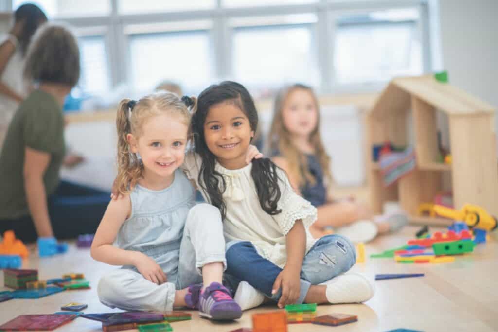 2 little girls that are friends at preschool