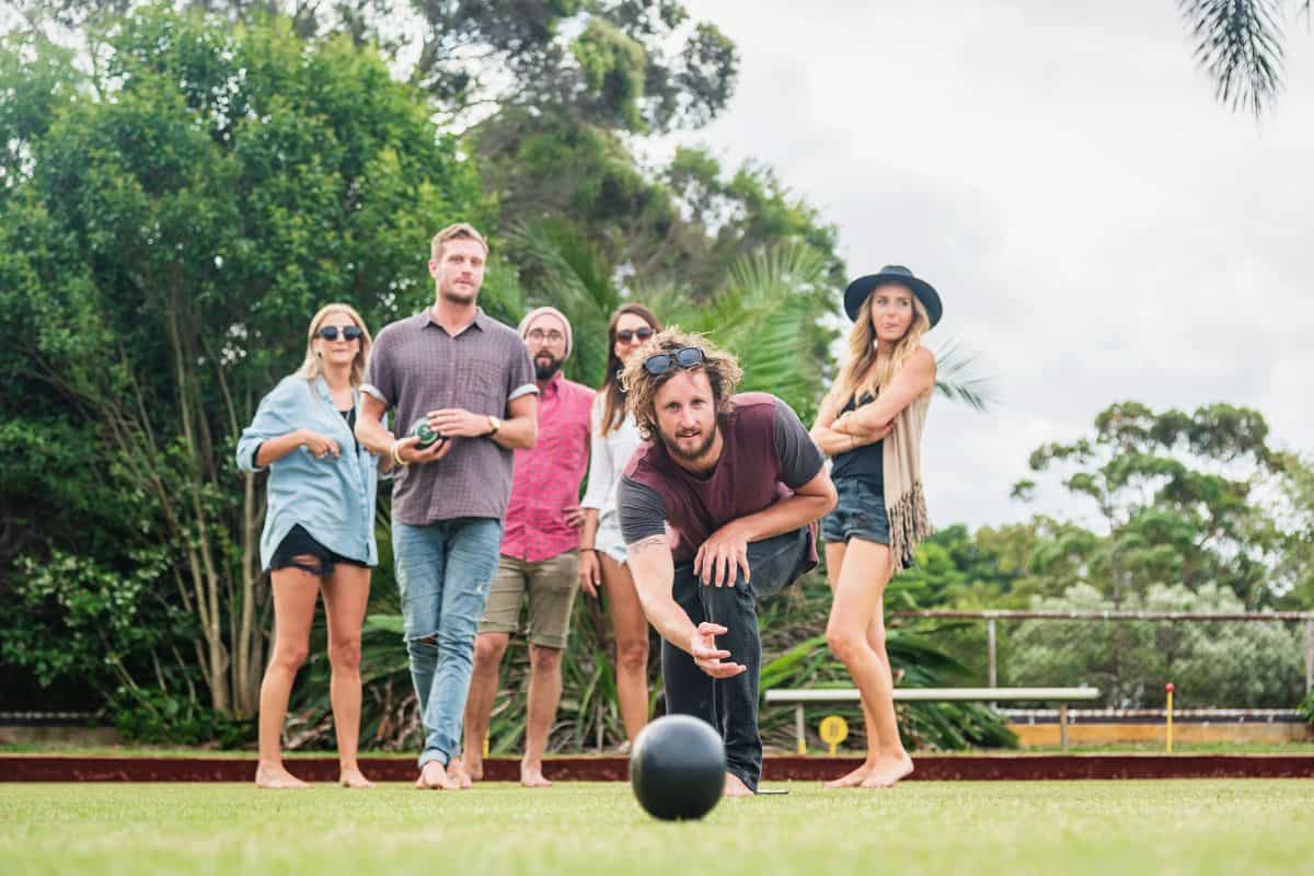 friends bowling outside at home