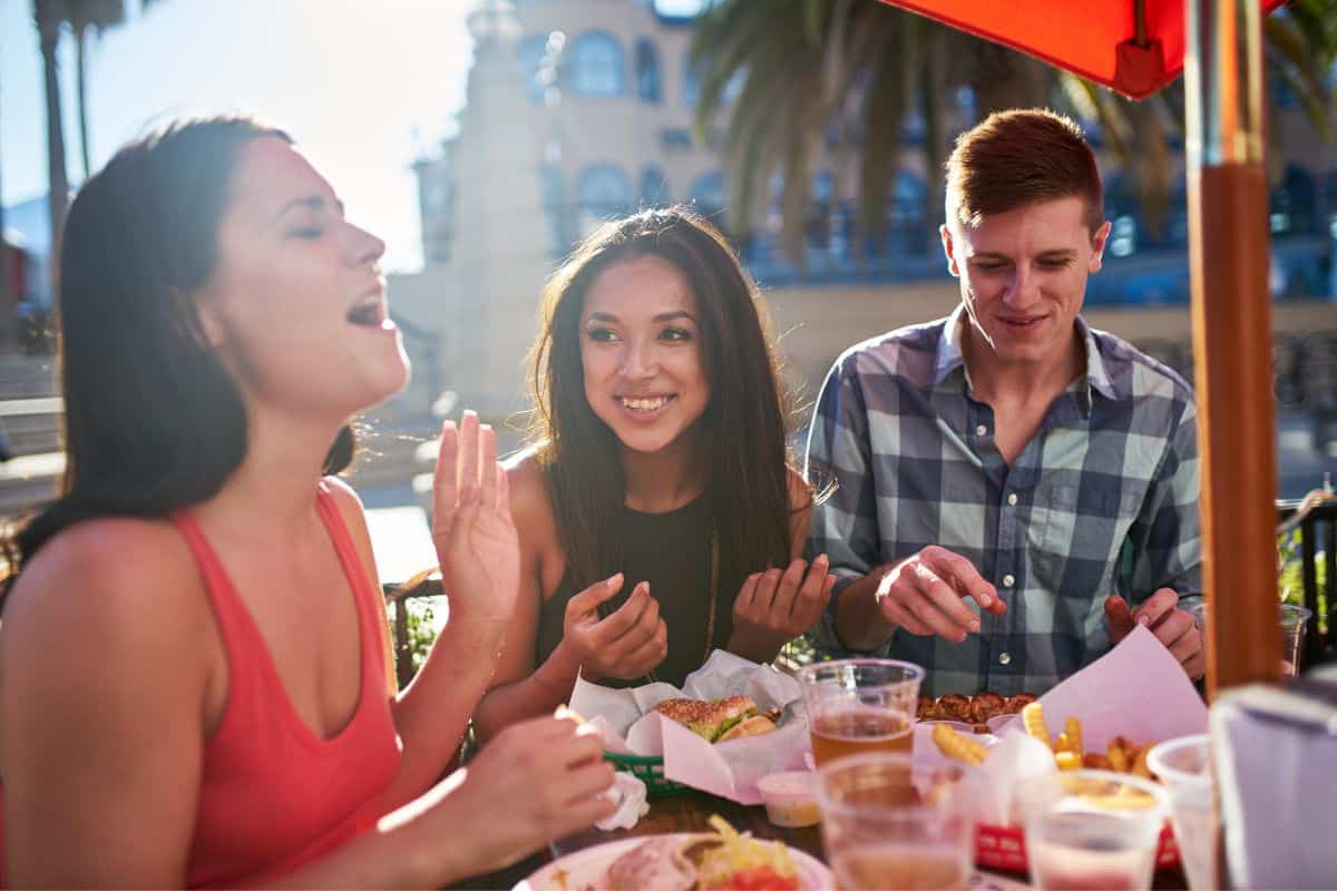 friends laughing at dinner