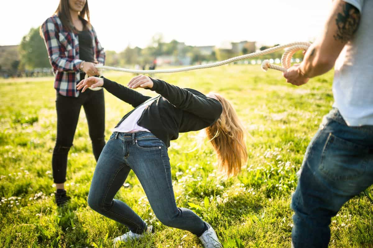 3 friends doing the limbo