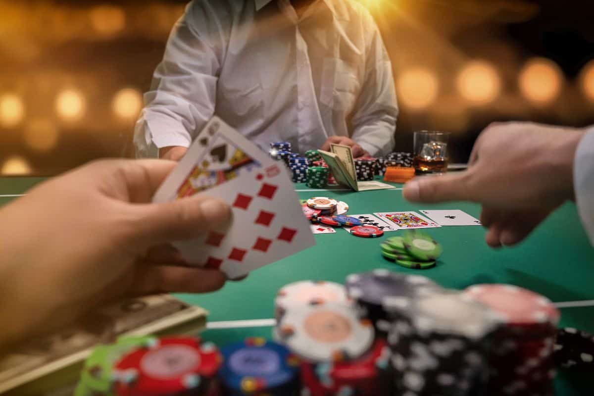 close up of people playing cards