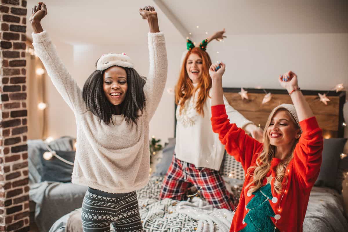 3 girls having a slumber party in winter clothing