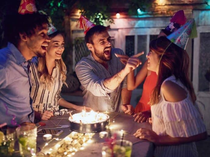 brother at his birthday party - putting cake on his date's nose