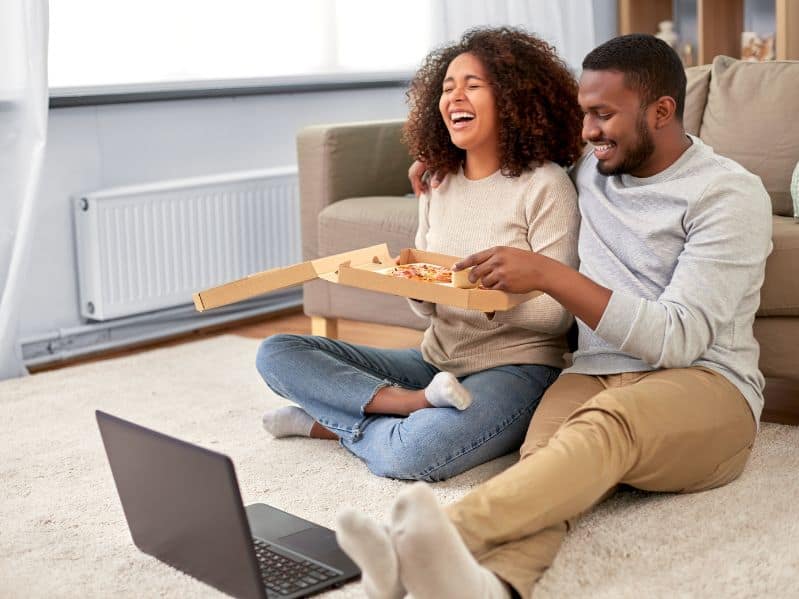 Couple enjoying a picnic at home