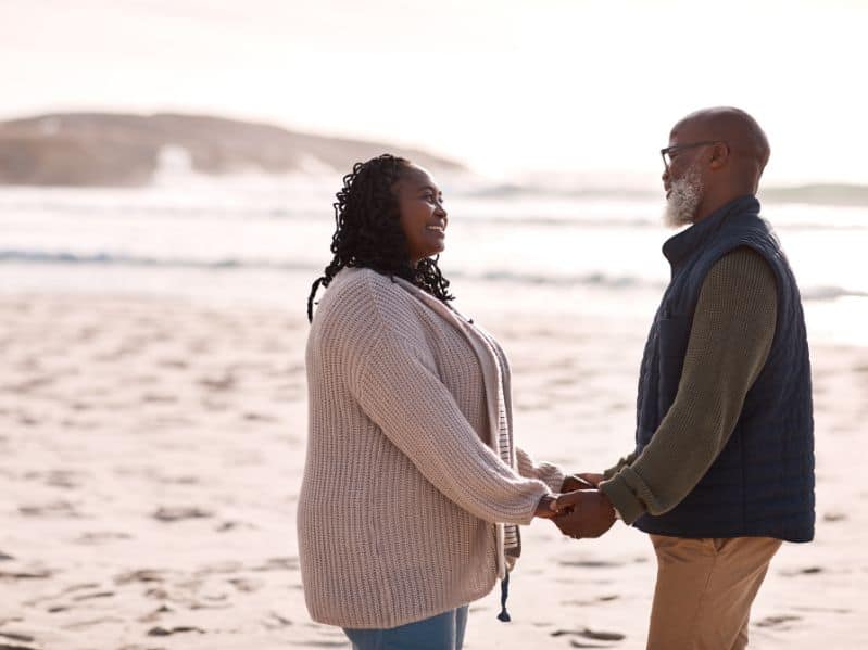 couple doing a vow renewal at the beach