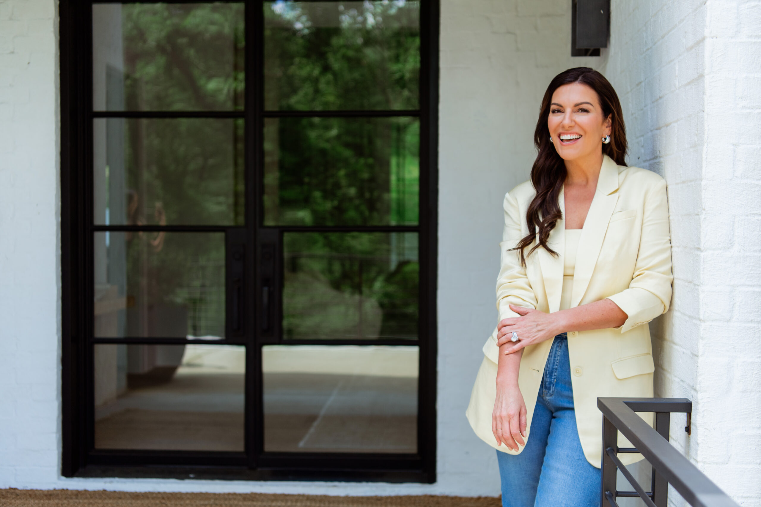 amy porterfield outside on a deck