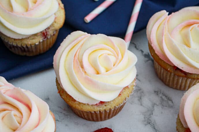 multiple raspberry white chocolate buttercream cupcakes