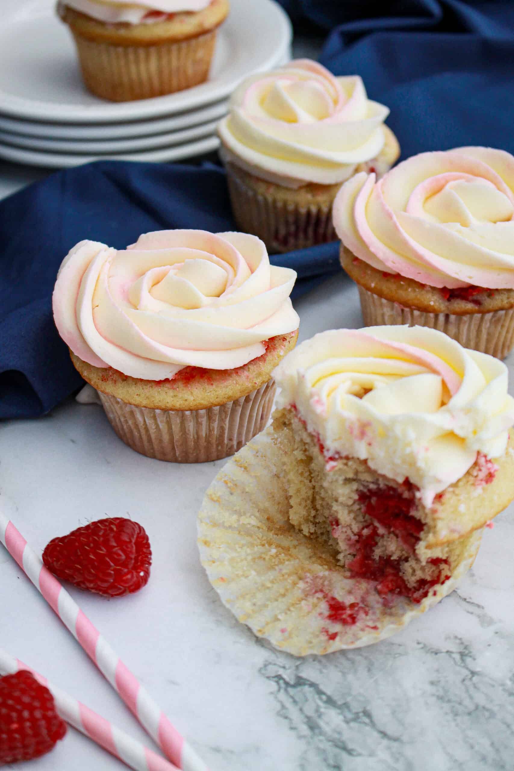 3 raspberry white chocolate cupcakes buttercream frosting - detail of the inside on one